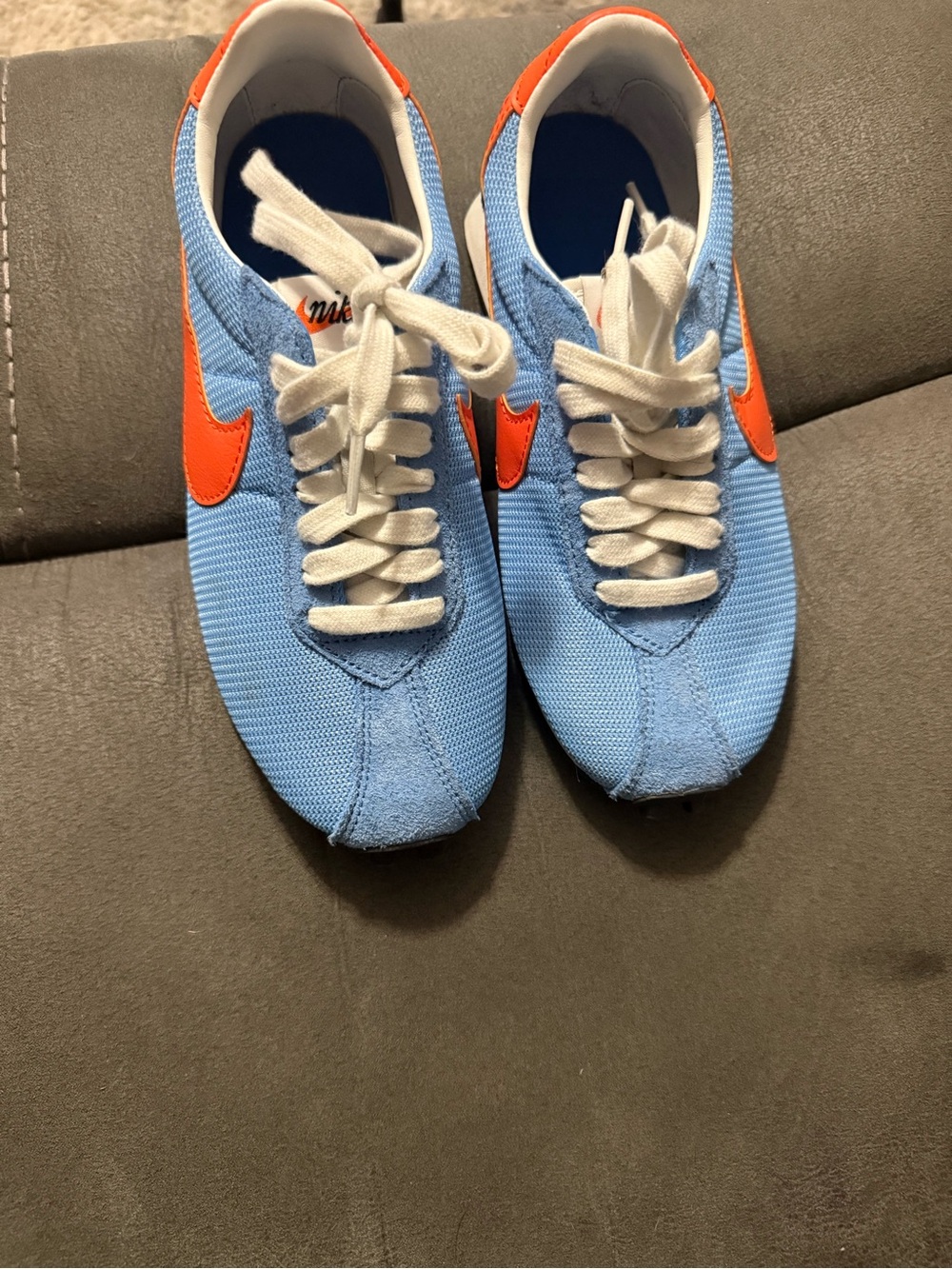 Nike Women's Light Blue Sneakers with Orange Swoosh
